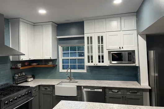 Completed kitchen project with white and charcoal cabinetry